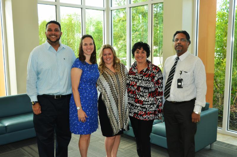 Dr Chandy Abraham and Shomari Scott with Canadian staff